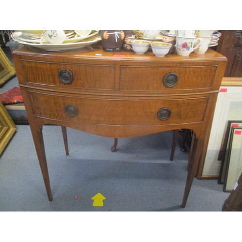 31 - An Edwardian bow fronted side table having three drawers and tapering legs 81cm h x 76cm w
Location:... 
