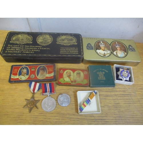 35 - Collectables to include a silver masonic medal, World War II medals and commemorative tins, two cont... 