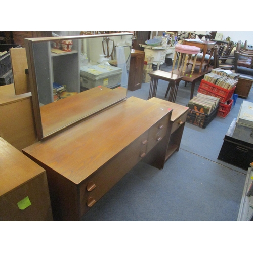 53 - A teak dressing table with adjustable mirror over three graduated drawers, 110..5 x 96.5 x 42cm, and... 