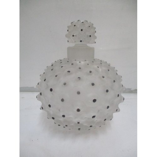 7 - A Lalique perfume bottle with protruding flower design and black dots
Location: 8.1