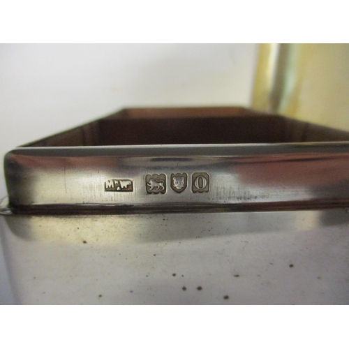 22 - An early 20th century silver cigarette box with initials to the lid, hallmarked London 1909, 5.5cm h... 