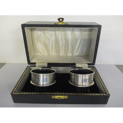 24 - A pair of boxed silver napkin rings with machine turned decoration, hallmarked Birmingham 1967, 25.1... 