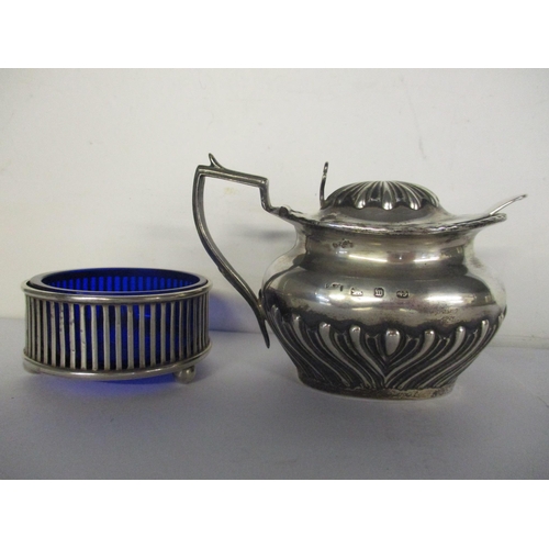 28 - A silver mustard pot and spoon together with a silver salt pot, weight excluding liner 138.1g
Locati... 