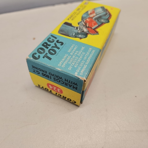 16 - A boxed Corgi toys 324 Marcos 1800 G.T
Condition: there is some weathering to the box to include wea... 