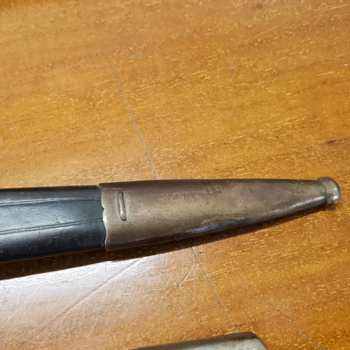 49 - A WWI German trench knife/dagger, blade engraved Carl Eickhorn Holingen, having an eagle head pommel... 