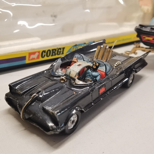 7 - A trademarked 1966 Corgi Batman Batmobile and Bat Boat boxed A/F. Condition: The box is worn and has... 