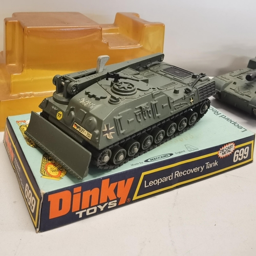 9 - A group of four Dinky Toys Military Vehicles to include the Dinky No.699 Leopard Recovery Tank boxed... 