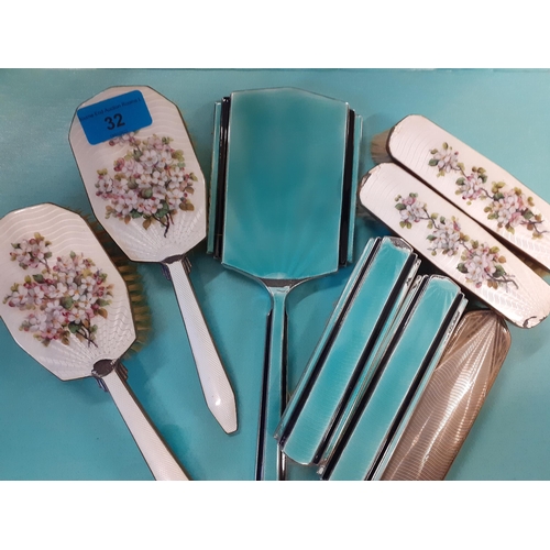 32 - An Art Deco silver and green enamelled back hand mirror and 2 matching brushes A/F, together with a ... 