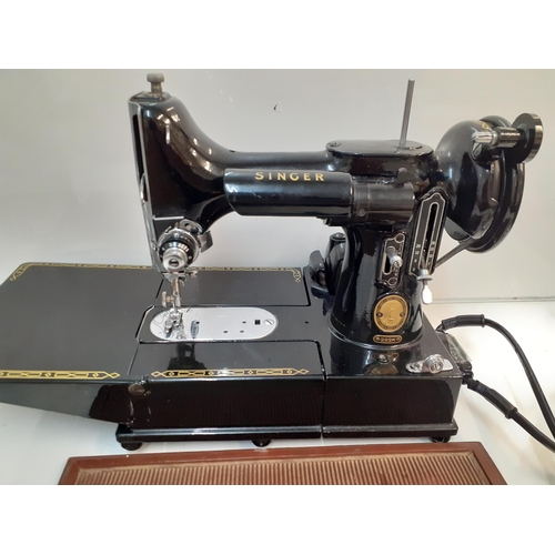 5 - A 1950's Singer 222K featherweight free-arm sewing machine in original case
Location:RWB