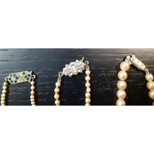 50 - A quantity of mainly mid to late 20th Century costume jewellery to include faux pearl and hard-stone... 
