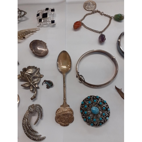 26 - Mixed costume jewellery to includer a silver brooch of 2 dancers, maker's initials D.H.P, a white me... 
