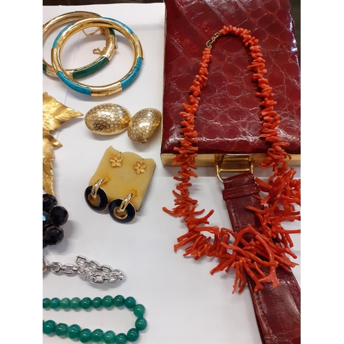 27 - Mixed costume jewellery to include a vintage red coral necklace, vintage gold tone brooches, earring... 
