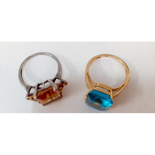 58 - An 18ct gold and pale blue cabochon ring together with a silver and amber coloured cabochon ring
Loc... 