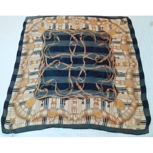 Paolo Gucci- A Sam Whan design, silk scarf with hand-sewn edges in black, cream, brown and gold colours depicting images of belts, buckles and tassels, 87cm x 87cm.
Condition: When held up to the light- several small areas of wear, a small area of pulls, no apparent stains-see photos
Location: RAB
