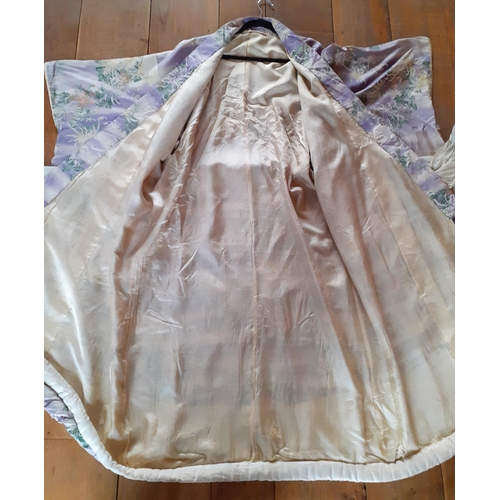20 - A 1930's/1940's Japanese silk kimono in pale lilac with Batik images of honeysuckles and leaves, hav... 