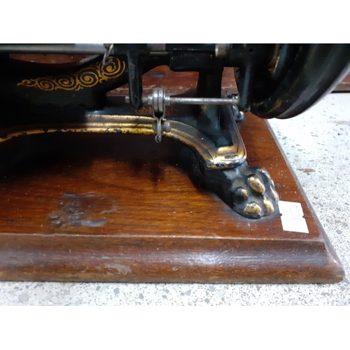 21A - Two vintage sewing machines comprising The Royal Shakespeare manufactured by the Royal Sewing Machin... 