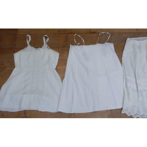 24 - Vintage ladies white cotton garments to include 4 mixed underskirts with lace trim (waistband to one... 