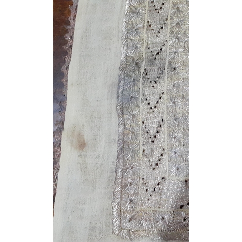 26 - A 19th Century cloth panel having elaborate gold metallic thread embroidery with 9 multi guard borde... 