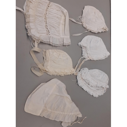 29 - Victorian and Edwardian white cotton ladies and children's clothing comprising 9 lightweight bonnets... 