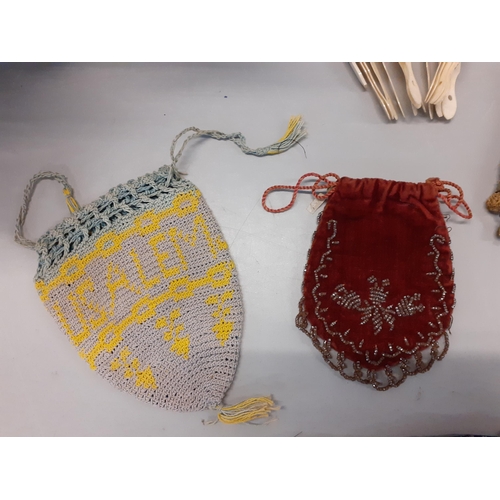 30 - Two Victorian crotchet miser's purses with ringed supports, a handmade and embroidered Jerusalem pur... 