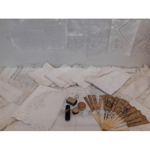 33 - Vintage white cotton and crotchet table cloths and place mats together with a 19th Century fan A/F, ... 