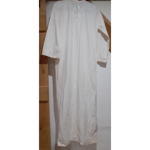 34 - A late 20th Century full length, white kaftan with cream brocade and white embroidery.
Location: RAI... 