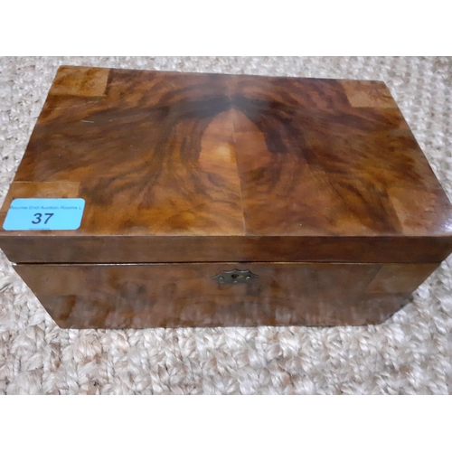 37 - An early 20th Century walnut jewellery box containing vintage jewellery to include 2 silver rings, o... 