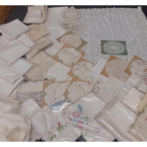 39 - A quantity of mainly mid 20th Century table linen and crotchet items to include embroidered tableclo... 
