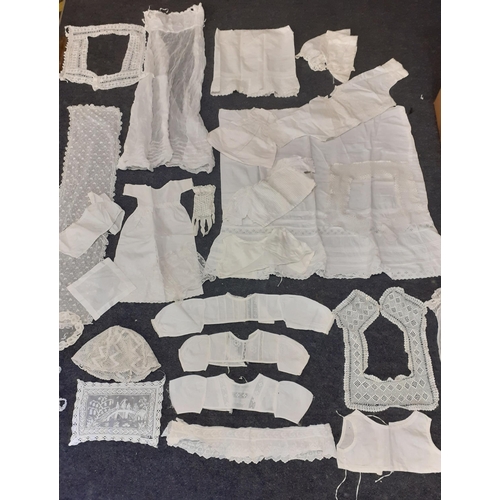 41 - Early to mid 20th Century children's and doll's cotton and lace clothing together with lace trimming... 