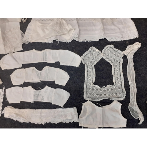 41 - Early to mid 20th Century children's and doll's cotton and lace clothing together with lace trimming... 
