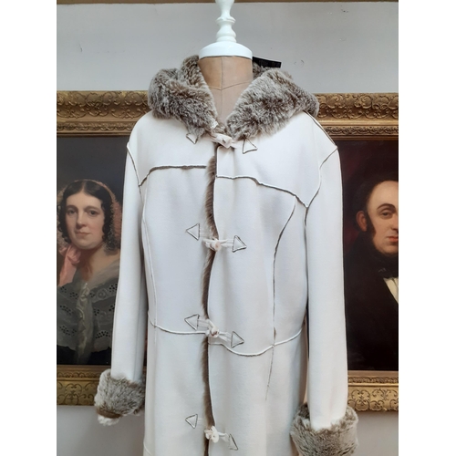 49 - John Rocha-A cream sheepskin full-length coat with faux fur lining, hood and 5 bone effect buttons, ... 