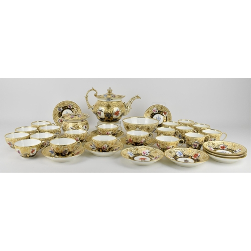 A large early Victorian Coalport tea service to include a teapot, a lidded sugar pot, a slop bowl, twelve tea cups, twelve saucers and seven coffee cups, all decorated with hand painted flowers and gilt embellishment