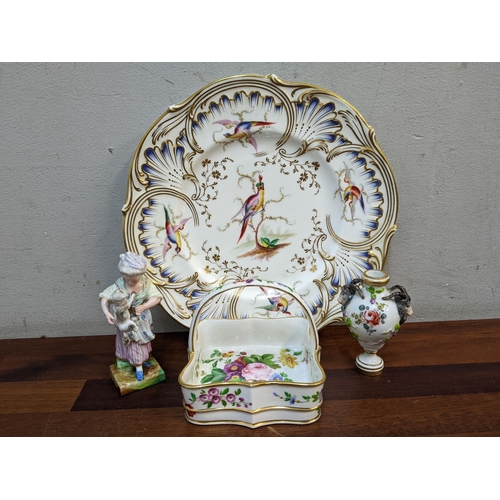 Nineteenth Century decorative ceramics to include a basket with floral painted ornament, a French miniature vase, a figure and a plate decorated with a bird
Location: 4.2