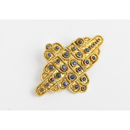 A contemporary Greek 18ct yellow gold and sapphire brooch by Zolotas, in the Byzantine style with collet mounted blue sapphires, 7 cm wide, weight 21 grams