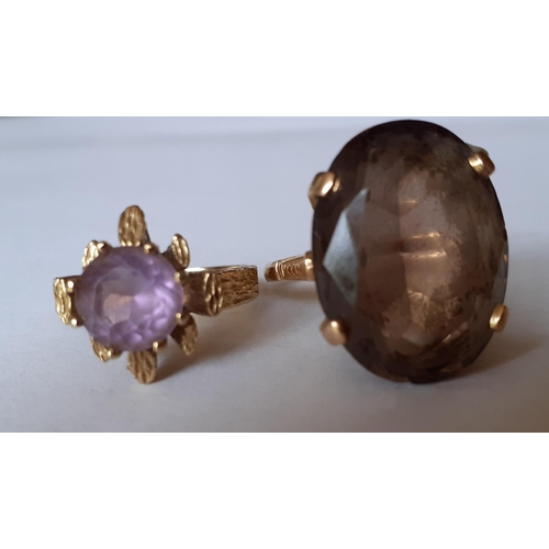 14 - A 9ct gold and amethyst dress ring together with a 9ct gold and smoky quartz ring and another, total... 