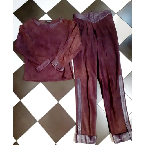 18 - Louis Feraud- A 1980's 2 piece ladies trouser outfit in an aubergine coloured suede with aubergine l... 