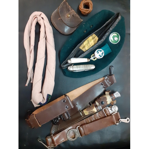 21 - Mid 20th Century Boy Scouts accessories to include a woggle, 2 belts, mixed knives and a cap
Locatio... 