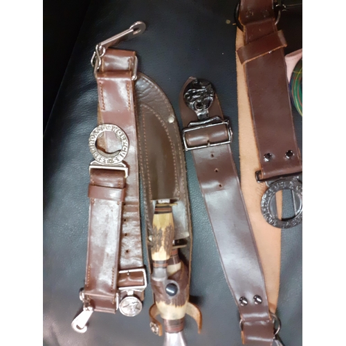 21 - Mid 20th Century Boy Scouts accessories to include a woggle, 2 belts, mixed knives and a cap
Locatio... 