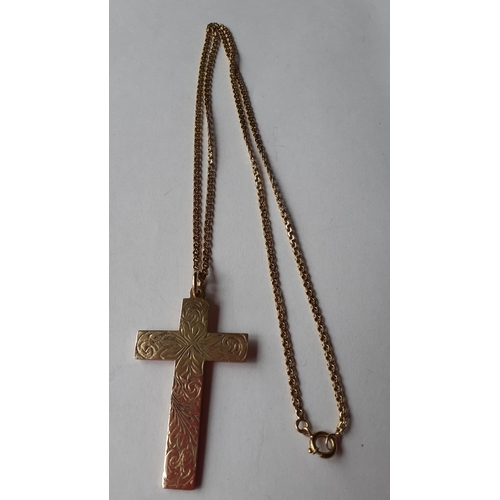 3 - A 9ct gold crucifix pendant stamped 375 with makers initials AJH, on a 9ct gold chain, weight 15g
Lo... 