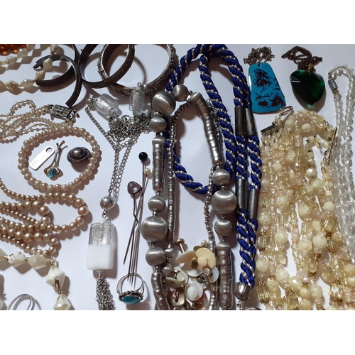 36 - Vintage costume jewellery to include 3 Eastern white metal bangles, one A/F, Continental painted bea... 