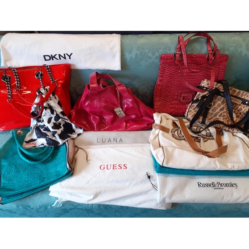48 - A quantity of modern handbags some new with tags and dust bags to include DKNY and Guess
Location:RA... 