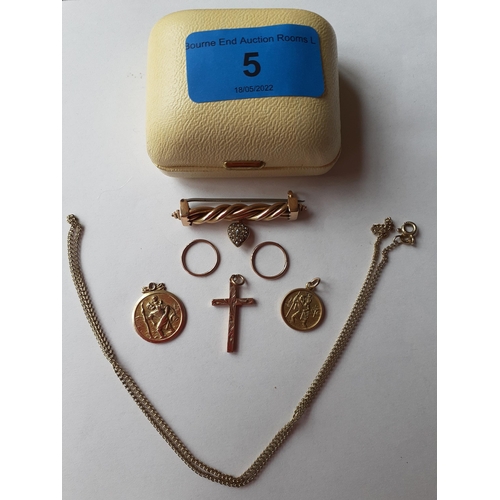 5 - A 9ct gold crucifix, a 9ct gold chain, two 9ct gold circular St Christopher pendants, a pair of yell... 