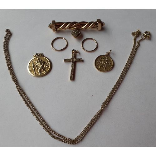 5 - A 9ct gold crucifix, a 9ct gold chain, two 9ct gold circular St Christopher pendants, a pair of yell... 