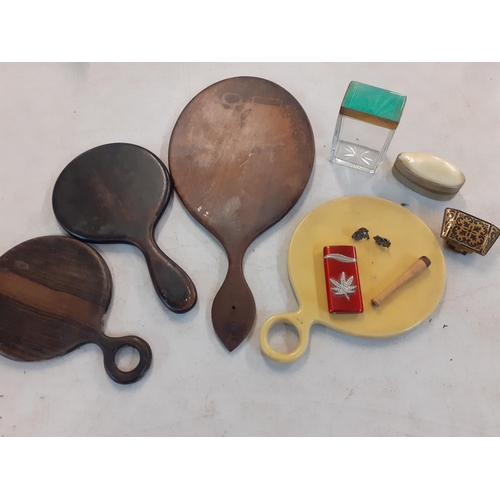 50 - A small mixed lot comprising early 20th Century hand mirrors, a shell topped trinket box, an enamel ... 
