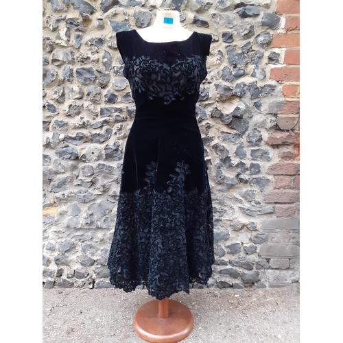 9 - Norman Hartnell-A 1950's black velvet and applique lace three quarter, sleeveless cocktail dress, wi... 