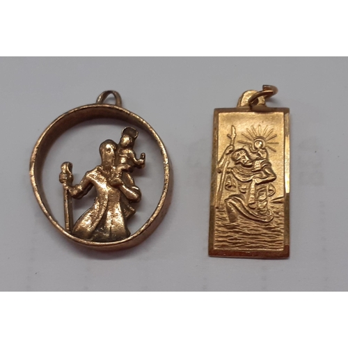 31 - A small 9 carat gold St Christopher pendant, 1.05g together with a yellow metal open ring pendant wi... 