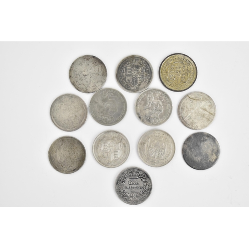 55 - A miscellaneous group of twelve shillings of George III, George IV, and William IV to include a Geor... 