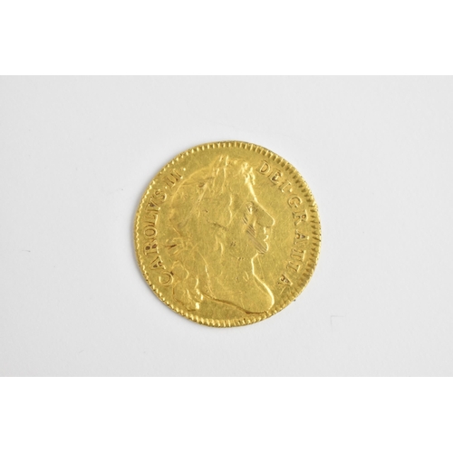 47 - Charles II (1660-1685) 1676 gold Guinea laureate bust, right, ℞, crowned quartered shields with scep... 