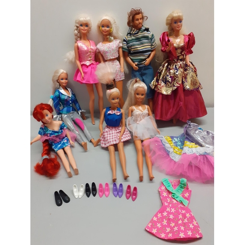 10 - A group of 1980s-1990s Barbie dolls, a Ken doll stamped 1968 to the lower back and a smaller Disney ... 