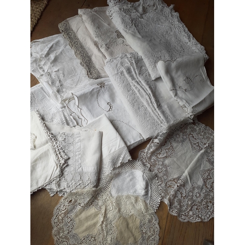 30 - A quantity of 20th Century table linen with machine made crotchet insertions and trims together with... 